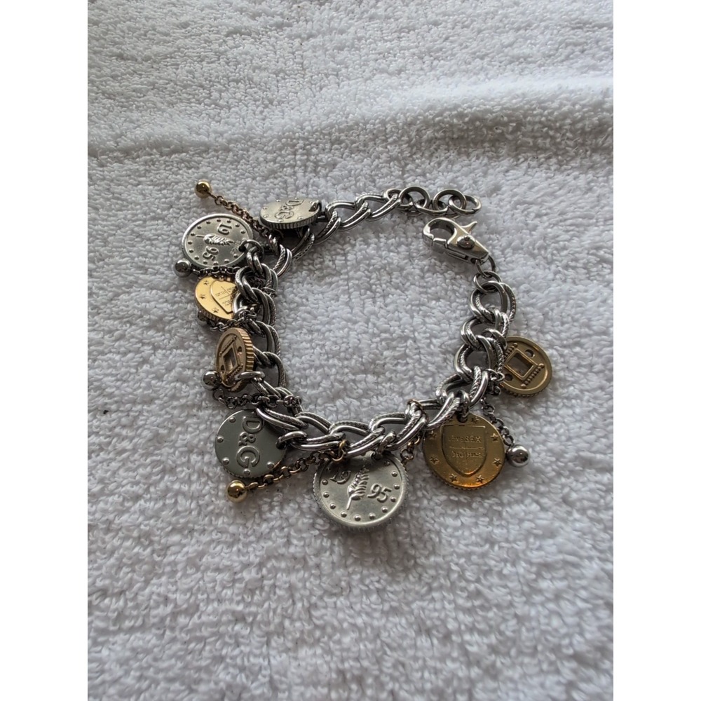 Dolce gabbana bracelet With 15 charms great condition,  8.5" long Heavy Piece